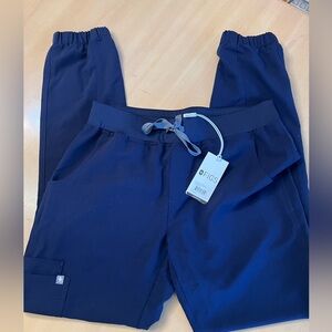 Brand new never worn. Navy blue Kade skinny jogger scrub pants. Size small/tall